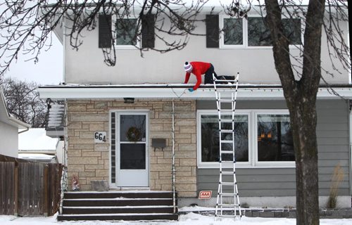 RUTH BONNEVILLE / WINNIPEG FREE PRESS

Kevin Rettit crawls along his 1st floor roof on the overhang of his two-storey house in River Heights Wednesday to finish stringing his Christmas Lights that he started hanging up yesterday.  He just happened to be wearing red which made him look like St. Nick had arrived early;.  

Standup photo


Nov 15, 2017