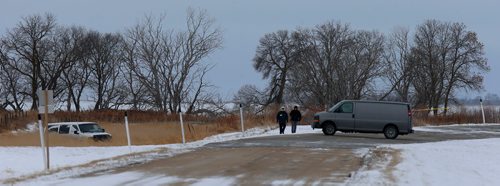 WAYNE GLOWACKI / WINNIPEG FREE PRESS

Investigators on Highway 417 near Lake Manitoba First Nation where a man was shot early Wednesday morning by the RCMP. At left is the RCMP vehicle involved in the ditch. Kevin Rollason  story   Nov. 15  2017