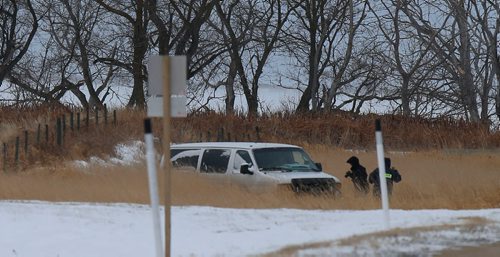 WAYNE GLOWACKI / WINNIPEG FREE PRESS

Investigators by the RCMP vehicle in the ditch along  Highway 417 near Lake Manitoba First Nation where a man was shot early Wednesday morning..Kevin Rollason  story   Nov. 15  2017