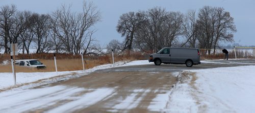 WAYNE GLOWACKI / WINNIPEG FREE PRESS

Investigators on Highway 417 near Lake Manitoba First Nation where a man was shot early Wednesday morning by the RCMP. At left is the RCMP vehicle in the ditch that was involved. Kevin Rollason  story   Nov. 15  2017