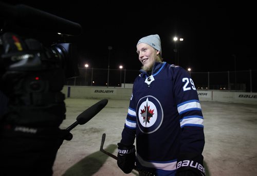 RUTH BONNEVILLE / WINNIPEG FREE PRESS


Laine is interviewed after game with kids.  
Patrik Laine, of the Winnipeg Jets, makes a surprise appearance as he walks onto the rink at the Valley Garden Community Club in Winnipeg where young 13-year-old AAA Sharks minor hockey players were playing a scrum game of street hockey and asks to  join in on their game.  After playing with the team he took some group photos and later in the locker room handed each player
a new BAUER Vapor 1X lite sticks for everyone.  The kids screened with excitement  because the stick it is the lightest stick Bauer has ever made. It's 399 grams, and 15 grams lighter than the previous model.   Receiving it from their local NHL star makes it even more special!

See Jay Bell's story.  


Nov 15, 2017