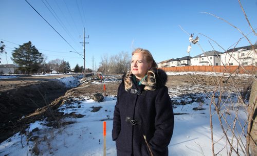 RUTH BONNEVILLE / WINNIPEG FREE PRESS


Kimberley Halischuck who has lived on  Ravelston Avenue West for years with her family, stands next to a ditch near her property where sewer services are being installed to upgrade area.  Halischuck  and agroup of Transcona residents in the area said city hall is forcing them to incur thousands of dollars to hook up to the underground water and sewer system to help a new residential developer in the area. 

See Santin story.
Nov 17, 2017