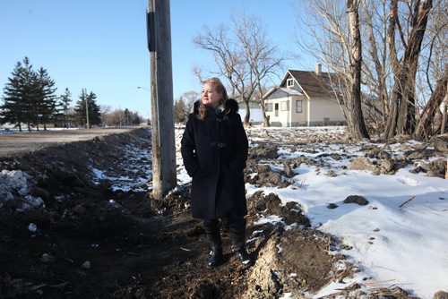 RUTH BONNEVILLE / WINNIPEG FREE PRESS


Kimberley Halischuck who has lived on  Ravelston Avenue West for years with her family, stands next to a ditch near her property where sewer services are being installed to upgrade area.  Halischuck  and agroup of Transcona residents in the area said city hall is forcing them to incur thousands of dollars to hook up to the underground water and sewer system to help a new residential developer in the area. 

See Santin story.
Nov 17, 2017