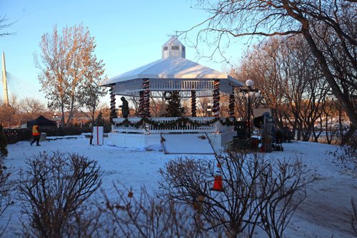 RUTH BONNEVILLE / WINNIPEG FREE PRESS

A set designer strings Christmas lights onto a ornate gazebo at The Forks behind the Children's Museum  during a break in shooting Friday.   The Hallmark movie being shot  in Winnipeg is called Christmas Connection and is due to be out on the 19th of December.  
Standup photo 
Nov 17, 2017