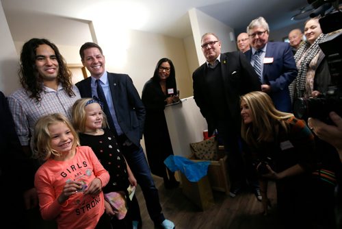 WAYNE GLOWACKI / WINNIPEG FREE PRESS

At left, Todd Gauthier and his daughters, Chloe, and Carmin,left, beside Mayor Brian Bowman in their Habitat for Humanity home on Lyle St. after receiving the keys at the  official ceremony Monday morning. Bill Redekop story   Nov. 20  2017