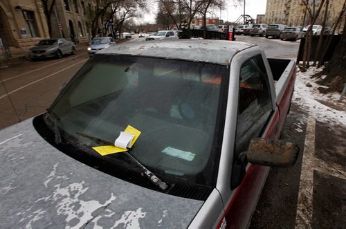 PHIL HOSSACK / WINNIPEG FREE PRESS  - Parking Politics - A trucked backed in the an angle parking spot on Bannatyne with a ticket.    - November 20, 2017