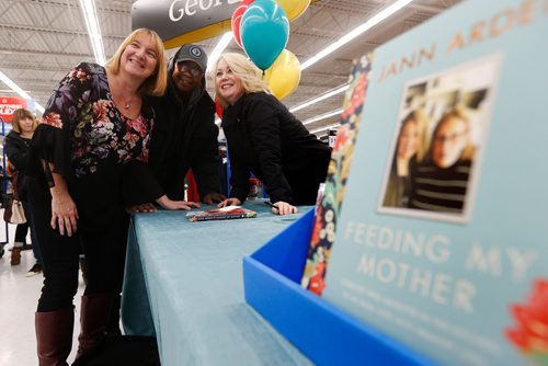 JOHN WOODS / WINNIPEG FREE PRESS
Jann Arden poses for a photo with Bev and Peter Henry after signing her book Feeding My Mother at a Winnipeg store Monday, November 20, 2017.