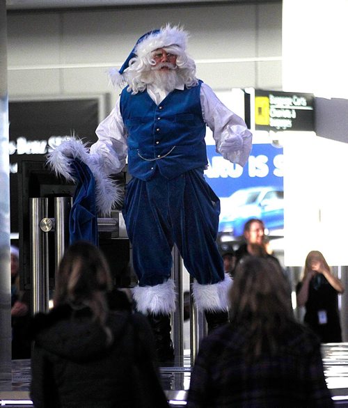 PHIL HOSSACK / WINNIPEG FREE PRESS  -  Travelers were treated to an appearance from WestJest's Blue Santa  Tuesday at Winnipeg James Armstrong Richardson International Airport. Westjet sponsored the event which included an abbrevited version of the Nutcracker by the RWB and an appearance by the airline's "Blue Santa".  - November 21, 2017