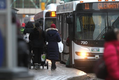 RUTH BONNEVILLE / WINNIPEG FREE PRESS

Transit fares will rise after the mayor tabled the City budget today.  Photos of people getting on the bus in downtown Winnipeg.  
See story.  
Nov 22, 2017