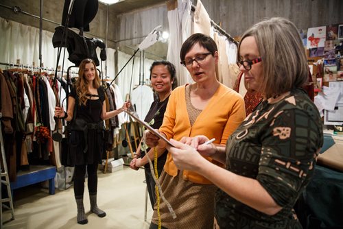 MIKE DEAL / WINNIPEG FREE PRESS
Judith Bowden, Costume Designer (right), and Thora Lamont a cutter in the Wardrobe department consult on the design of the costume for the Ghost of Christmas Future while Eva Kuo, Properties Builder and actress Lindsay Johnson standby. 
A behind the scene look during the preparation for the Royal Manitoba Theatre Centre's production of A Christmas Carol.
171108 - Wednesday, November 08, 2017.
