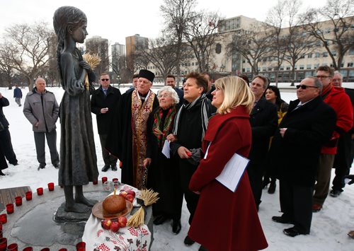 WAYNE GLOWACKI / WINNIPEG FREE PRESS

In the forground from right, Sport, Culture and Heritage Minister Cathy Cox, Ron Schuler, MLA, Sonia Kushliak and Monsignor Michael Buyochok by The Bitter Memories Of Childhood monument on the Manitoba Legislative grounds for a ceremony Thursday to remember the Ukrainian famine genocide of 1932 to 1933. Sonia of Winnipeg is a Holodomor survivor who was eight years old in the Ukraine when the famine began.  During the Soviet governments regime, millions of Ukrainians starved to death during the Holodomor, which translates into death by hunger. Manitoba is among jurisdictions around the world that formally commemorate the Holodomor annually on the fourth Saturday of November, known in Manitoba as Ukrainian Famine and Genocide (Holodomor) Memorial Day. This year it takes place  on Nov. 25.  During Thursdays question period  Minister Cathy Cox introduced a moment of silence and stalks of wheat, tied with a black ribbon were placed on the desk of every member of the legislative assembly. See Manitoba Govt release story.  Nov. 23  2017