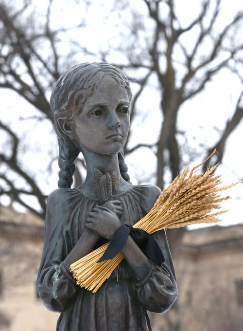WAYNE GLOWACKI / WINNIPEG FREE PRESS

A sheath of wheat was placed under the arm of the starving girl depicted in The Bitter Memories Of Childhood monument on the Manitoba Legislative grounds for a ceremony Thursday in advance of Ukrainian Famine and Genocide Memorial Day on Nov. 25.       see Manitoba Govt release story.  Nov. 23  2017