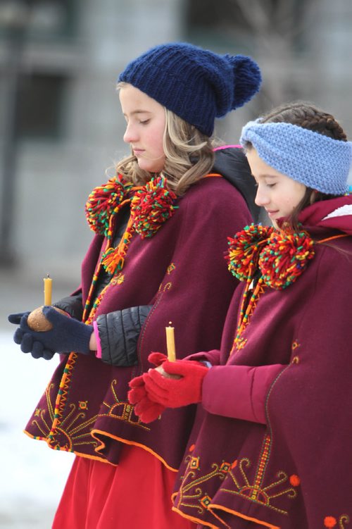 RUTH BONNEVILLE / WINNIPEG FREE PRESS

The Ukrainian Canadian community, government officials and others attend Ceremony marking the Holodomor famine genocide in Ukraine which took place in 1932-33, at City Hall Saturday.  

Sisters Valentyna malyarchuk (taller) and Alesia (twins, 10yrs) hold a lit candle in small loaf of bread which is symbolic for the Holodomor ceremony as the stand outside City Hall during part of the service Saturday.  
Nov 25, 2017