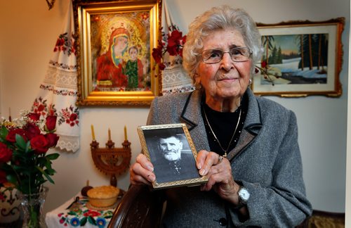 WAYNE GLOWACKI / WINNIPEG FREE PRESS

Holodomor survivor Sonia Kushliak in her apartment in Winnipeg.  She was eight years old in Ukraine when the famine began. She is holding a framed photograph of her father Andrij Sulyma. Kevin Rollason story Nov. 27  2017