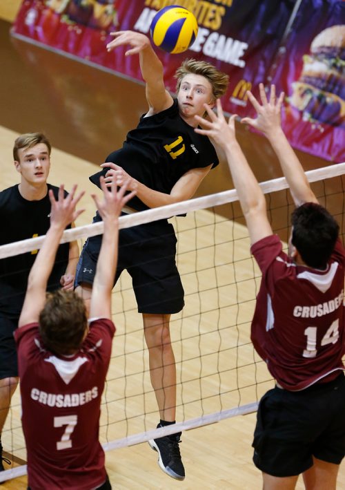 JOHN WOODS / WINNIPEG FREE PRESS
Steinbach Sabres' Tony Nickle (11) spikes against St Paul's Crusders' Nicholas Brzak (7) and Justin Cross (14) in the 2017 MHSAA AAAA JV Provincial Volleyball final at the University of Manitoba Monday, November 27, 2017.