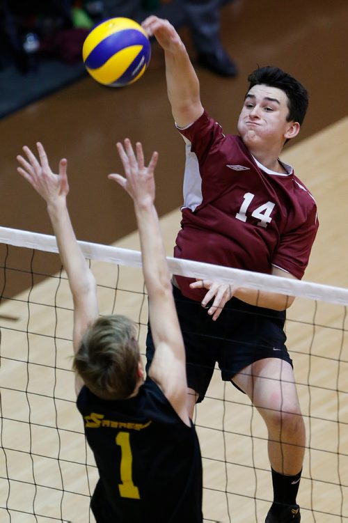 JOHN WOODS / WINNIPEG FREE PRESS
St Paul's Crusders' Justin Cross (14) spikes against Steinbach Sabres'  Parker Rempel (1) in the 2017 MHSAA AAAA JV Provincial Volleyball final at the University of Manitoba Monday, November 27, 2017.