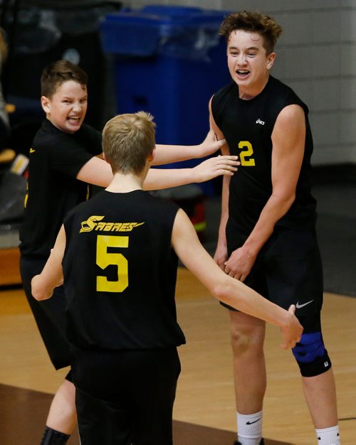 JOHN WOODS / WINNIPEG FREE PRESS
Steinbach Sabres' brothers Tyson Koop (4) (L) and Paxton Koop (2) celebrate with Mason Kehler (5)  after defeating the St Paul's Crusaders in the 2017 MHSAA AAAA JV Provincial Volleyball final at the University of Manitoba Monday, November 27, 2017.