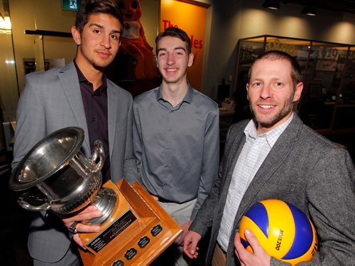 BORIS MINKEVICH / WINNIPEG FREE PRESS
2017 AAAA Boston Pizza Volleyball Championships press conference at Sport for Life Centre/Manitoba Sports Hall of Fame. From left, Lord Selkirk Royals volleyball players Nigel Nielsen, Tim Juvonen, and coach Jeff Scarcello with  the cup that they won last year and hope to win again this year. Nov. 28, 2017