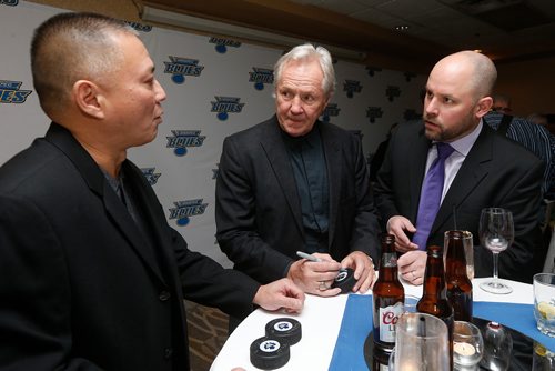 JOHN WOODS / WINNIPEG FREE PRESS
Al Chan (L) and Brian Kelly (R) get pucks signed by former Toronto Maple Leaf Darryl Sittler at the Winnipeg Blues Gala Fundraising Dinner Tuesday, November 28, 2017.