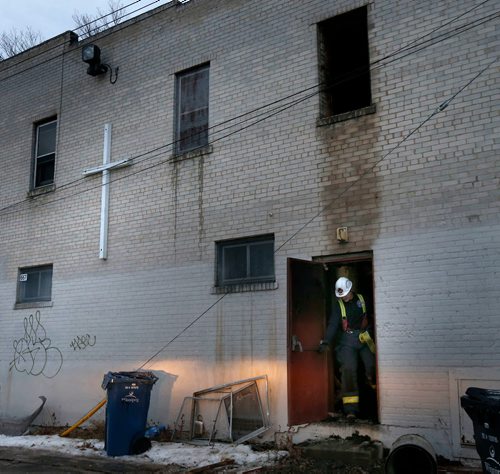 WAYNE GLOWACKI / WINNIPEG FREE PRESS

Fire investigator at the back of the Celestial Church of Christ at¤667 Flora Ave.¤¤after an early morning¤fire Wednesday. ¤Bill Redekop story  Nov. 29  2017
