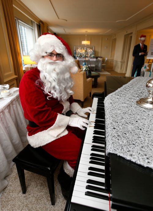 WAYNE GLOWACKI / WINNIPEG FREE PRESS

Santa Claus poses with the baby grand piano after checking into the Royal Alexandra Suite decorated for the festive season in the Fairmont Winnipeg Hotel Wednesday for the second annual event to raise money for the Childrens Wish Foundation. Santa will be posing for pictures with visitors in his Fairmont Winnipeg Santa Suite for $10 per visiting group. This includes a professional photo with Santa. Santa is available on the next three Saturdays and Sundays ending on Sunday Dec. 17.  The times are are 10A.M.-12:30P.M. and 1:00P.M.-3P.M Nov. 29  2017