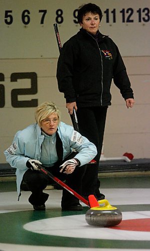 BORIS MINKEVICH / WINNIPEG FREE PRESS  081102 Brandon curler Lois Fowler, lower in blue, and Rita Vande Vyvere, of the Heather  C.C., curl against each other at the Lloyd Gunnlaugson Memorial Senior Bonspiel, at the Thistle Curling Club.