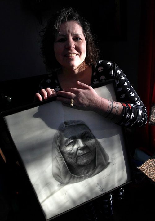 PHIL HOSSACK / WINNIPEG FREE PRESS  -   URBAN INUIT - Serena Hickes poses with a drawing of her grandmother Jenny, the namesake of the new Anaanatsiaq-Jenny's Place Inc. See Alex Paul's story.  - November 30, 2017
