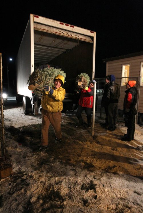 First Kirkfield Scouting Group &   Wpg Optimists Athletics Running Club.  RUTH BONNEVILLE / WINNIPEG FREE PRESS

Volunteers unload Christmas trees at Deer Lodge Golf Course Thursday evening.  A portion of the funds raised from the sale of the trees go to First Kirkfield Scouting Group &  Wpg. Optimists Athletics Running Club which the volunteers are a part of.
Standup photo



Nov 30, 2017