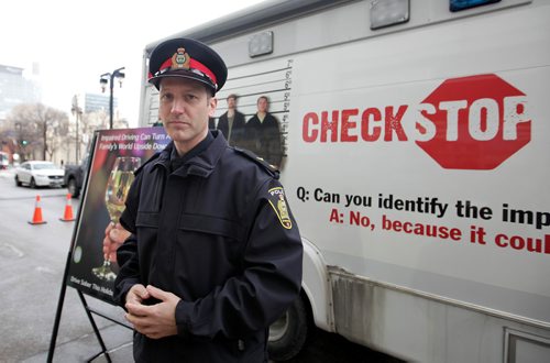 RUTH BONNEVILLE / WINNIPEG FREE PRESS

Constable Stéphane Fontaine stands next to Check Stop at media briefing announcing this year's launch of WPS Checkstop at Police HQ Friday.  



Dec 01, 2017
