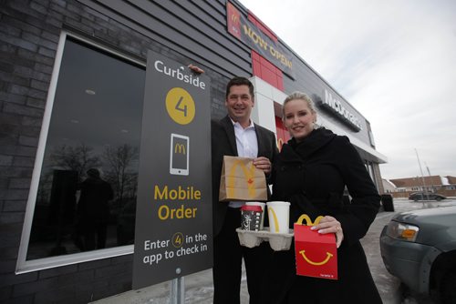 RUTH BONNEVILLE / WINNIPEG FREE PRESS

Dwayne & Dayna (wife)  Carter owners of the new McDonald's Restaurant on Devonshire Drive, stand next to mobile order parking spot which is one of the 1st McDonald's  in Canada to offer this new service,  at their grand opening Friday.

See story by Erik Pindera.  
Dec 01, 2017