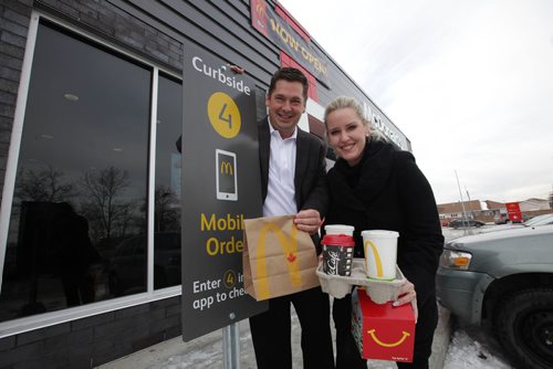 RUTH BONNEVILLE / WINNIPEG FREE PRESS

Dwayne & Dayna (wife)  Carter owners of the new McDonald's Restaurant on Devonshire Drive, stand next to mobile order parking spot which is one of the 1st McDonald's  in Canada to offer this new service,  at their grand opening Friday.

See story by Erik Pindera.  
Dec 01, 2017