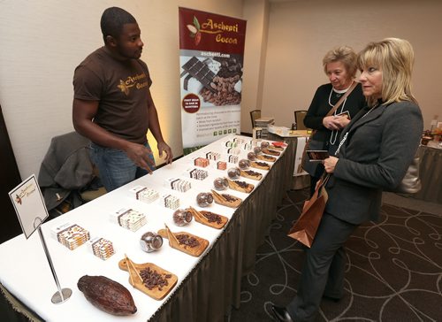 JASON HALSTEAD / WINNIPEG FREE PRESS

Julie Radchuk (second left) and Sandy Dzuba check out Christian Mekoh's Aschenti Cocoa stand at the Canadian Cancer Societys second annual Everything Chocolate Event on Nov. 17, 2017 at the Hilton Winnipeg Airport Suites. Mekoh is owner and chocolate maker of the Corydon Avenue business. (See Social Page)
