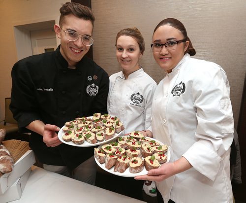 JASON HALSTEAD / WINNIPEG FREE PRESS

Alex Loiselle (owner and director of operations), Erica Brunet (kitchen manager) and Deiwan Tang (baker) of La Belle Baguette show their chocolate baguette with white chocolte hummus at the Canadian Cancer Societys second annual Everything Chocolate Event on Nov. 17, 2017 at the Hilton Winnipeg Airport Suites. (See Social Page)