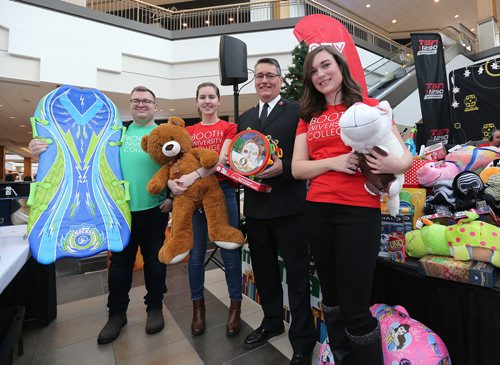 JASON HALSTEAD / WINNIPEG FREE PRESS

Booth University College students (from left) Zach Marshall, Kaitlyn VanDeursen and Amy Patrick hold toys from the Toy Mountain with Salvation Army Maj. Rob Kerr at the Salvation Army's Toy Mountain gift drive at Polo Park on Dec. 1, 2017. The toys were purchased with $1,000 in funds raised by Booth University College's Student Life Committee for the Salvation Army's Toy Mountain Campaign.(See Social Page)