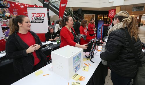 JASON HALSTEAD / WINNIPEG FREE PRESS

ScotiaBank staff members Ashleigh McLaren (left) and Melissa Philp accepts toys and children's gifts at the Salvation Army's Toy Mountain gift drive at Polo Park on Dec. 1, 2017. (See Social Page)