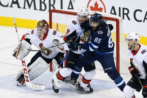 JOHN WOODS / WINNIPEG FREE PRESS
Winnipeg Jets' Mathieu Perreault (85) and Ottawa Senators' Cody Ceci (5) fight for position in front of goaltender goaltender Mike Condon (1) during first period NHL action in Winnipeg on Sunday, December 3, 2017.
