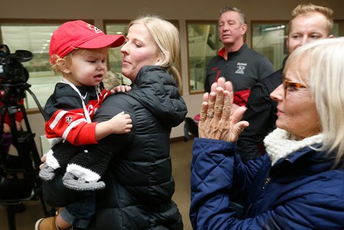 JOHN WOODS / WINNIPEG FREE PRESS
Team Canada hockey player Bailey Bram holds her nephew Cayson as family looks on after an autograph session in St Anne Monday, December 4, 2017. Canada plays the USA tomorrow in Winnipeg