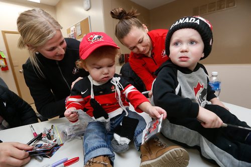 JOHN WOODS / WINNIPEG FREE PRESS
Team Canada hockey players Bailey Bram (L) and Jocelyne Larocque  sign their autographs on Cayson Bram and Carter Hudrick's shirts in St Anne Monday, December 4, 2017. Canada plays the USA tomorrow in Winnipeg