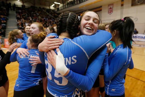 JOHN WOODS / WINNIPEG FREE PRESS
College Jeanne-Sauve Olympiens' Cierra Cyr (35)(L) embraces Erika Vermette (20) as they celebrate defeating the Portage Collegiate Saints in the 2017 Manitoba High Schools Athletic Association AAAA Provincial High School Volleyball Championships at the University of Manitoba Monday, December 4, 2017.
