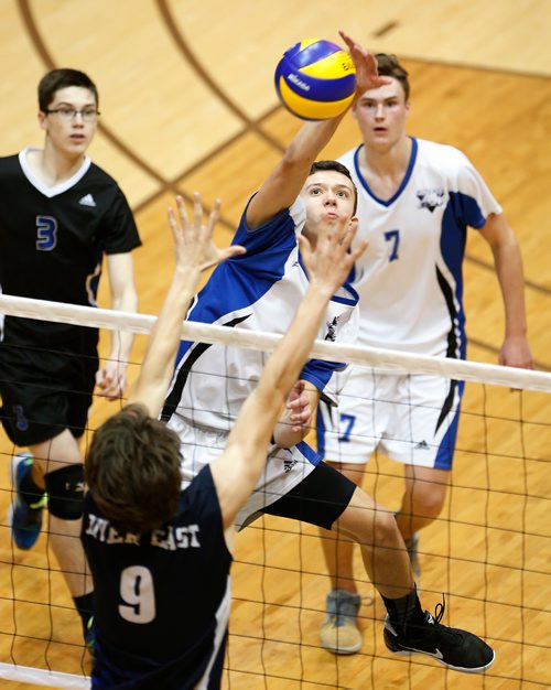 JOHN WOODS / WINNIPEG FREE PRESS
Lord Selkirk Royals' Nick Brzoza (6) spikes against River East Kodiaks in the 2017 Manitoba High Schools Athletic Association AAAA Provincial High School Volleyball Championships at the University of Manitoba Monday, December 4, 2017.