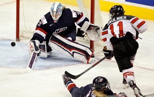 PHIL HOSSACK / WINNIPEG FREE PRESS  - Team Canada #11 Jillian Saulner homes in on USA netminder Alex Rigsby as she clears the puck from her crease late in the third period at MTS Place Tuesday evening. See story.. -  December 5, 2017