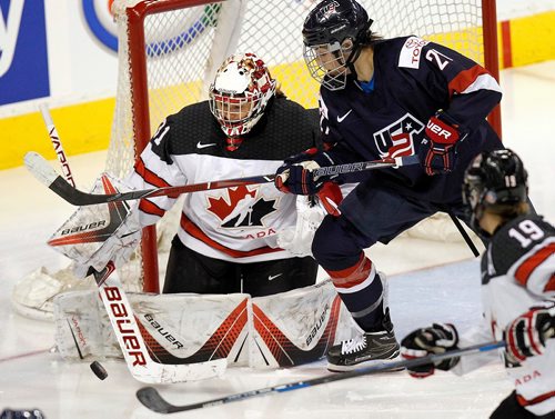PHIL HOSSACK / WINNIPEG FREE PRESS  - Team Canada netminder #31 Genevieve Lacasse fields an effort from USA's #21 Hillary Knight in the third period at MTS Place Tuesday evening. See story.. -  December 5, 2017