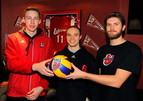 BORIS MINKEVICH / WINNIPEG FREE PRESS
From left, Wesmen basketball player Billy Yaworsky,  Wesmen volleyball players Logan Brennan and Taylor Howe with their gift of a volleyball (from Billy). It was ceremonial as this years Westman Classic university tournament will be volleyball this year instead of basketball. First ever Wesmen Classic mens volleyball tournament. MIKE SAWATZKY STORY. Dec. 6, 2017