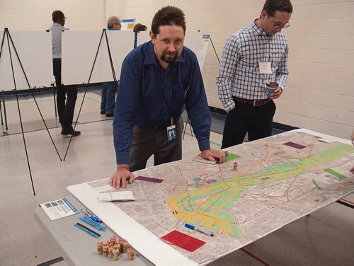 Canstar Community News City planner David Patman explains a mapping exercise whereby the public can express interest or disapproval of potential routes for Rapid Transit's Eastern Corridor at a workshop at Chalmers Community Centre (480 Chalmers Ave.) on Nov. 28. The City held a week's worth of workshops on the project from Nov. 24 to 30. (SHELDON BIRNIE/CANSTAR/THE HERALD)