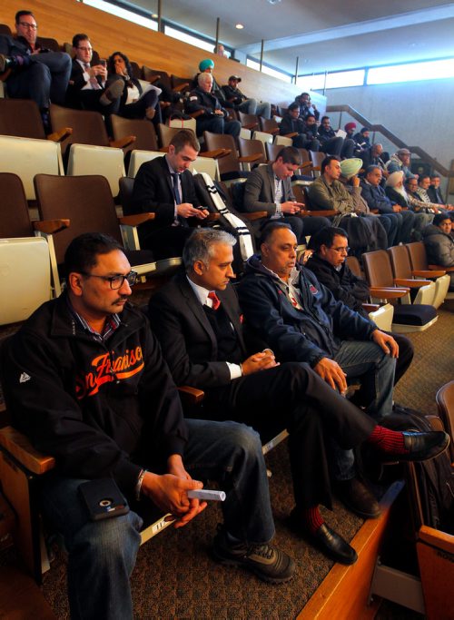 BORIS MINKEVICH / WINNIPEG FREE PRESS
People including cab drivers line the gallery of Winnipeg City Hall. Second from left/bottom is Ajay Chopra, a consultant and lobbyist for Unicity and Duffys. ALDO SANTIN STORY. Dec. 6, 2017