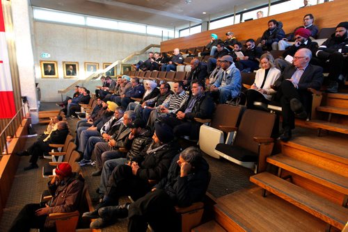 BORIS MINKEVICH / WINNIPEG FREE PRESS
People including cab drivers line the gallery of Winnipeg City Hall. ALDO SANTIN STORY. Dec. 6, 2017