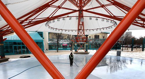 WAYNE GLOWACKI / WINNIPEG FREE PRESS

Andrew Evans floods the rink under the canopy at The Forks Thursday morning, they plan to have the rink ready for skating this weekend. Dec. 7  2017