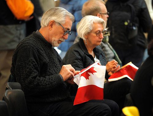 PHIL HOSSACK / WINNIPEG FREE PRESS  - Jim Penner sits embroidering the recommendations of the Truth and Reconciliation Commission onto a Canadin Flag before listening to Chief Erwin Redsky's update on Freedom Road. See Alex Paul's story. . -  December 9, 2017