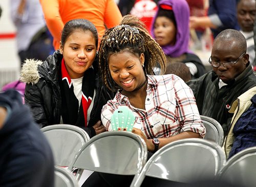 PHIL HOSSACK / WINNIPEG FREE PRESS  - STAND-UP  -- Deisy Lorena Gomez (left) and Eveline Kabuha (both 16) spend the  afternoon perfecting their "selfie" at the 7th annual Newcomers Emplyoment & Education Development Services (NEEDS) Winter Festival.  See release . -  December 9, 2017