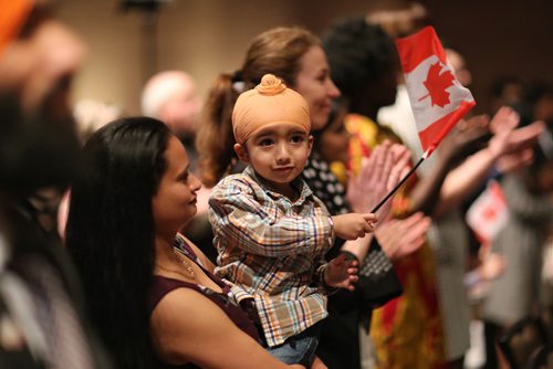 TREVOR HAGAN / WINNIPEG FRESS
Amritbal Mann, holding her son, Adhijeet, 2, from India, after becoming Canadian citizens during a ceremony at the Museum for Human Rights, Sunday, December 10, 2017.